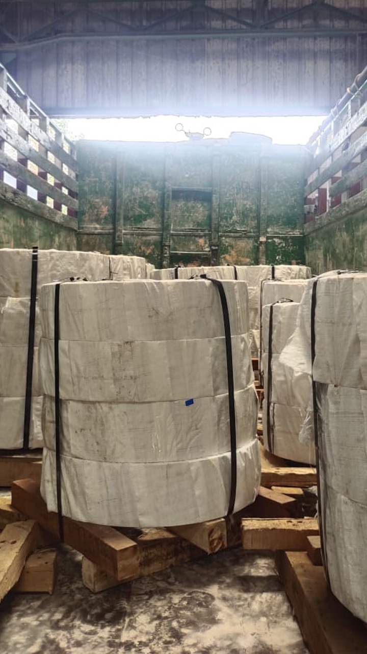 Wrapped coils strapped onto timber dunnage inside a container ready for dispatch